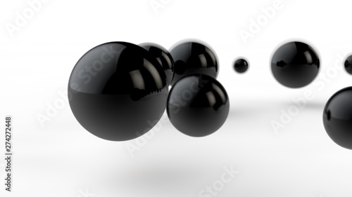 3D illustration of large and small black balls, spheres, geometric shapes isolated on a white background. Abstract, futuristic, cropped image of perfectly shaped objects. 3D rendering