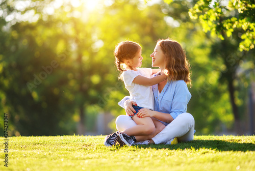 happy family mother and child daughter in nature   in summer