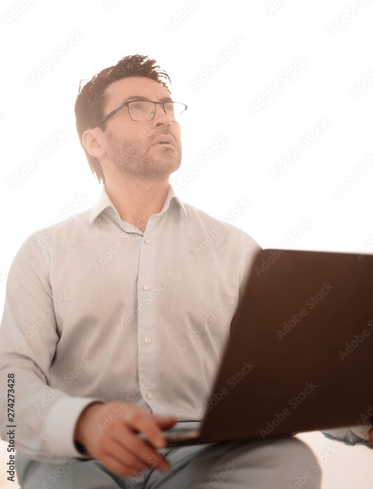 close up.serious businessman with a laptop close up.serious businessman with a laptop
