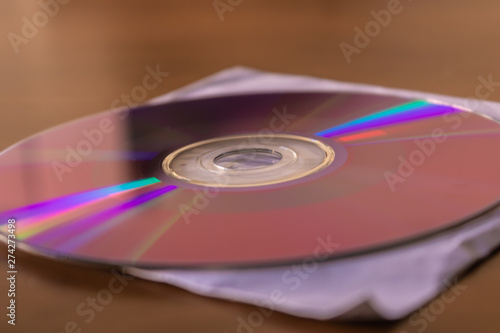 CD DVD disc on white paper cover box closeup - Image