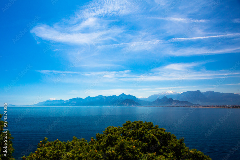 Beautiful view of the Mediterranean Sea, mountains, and trees. Turkey, Antalya.