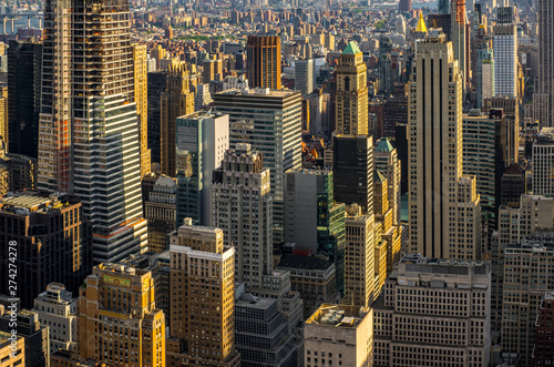 Obraz na plátně Cityscape of midtown skyscrapers and buildingds at sunset view from rooftop Rock