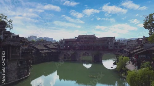 Aerial view crossing Tuojiang river. Old bridges connects both sides of Fenghuang, Hunan, China