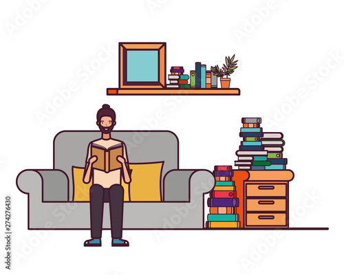 man with book in hands in living room