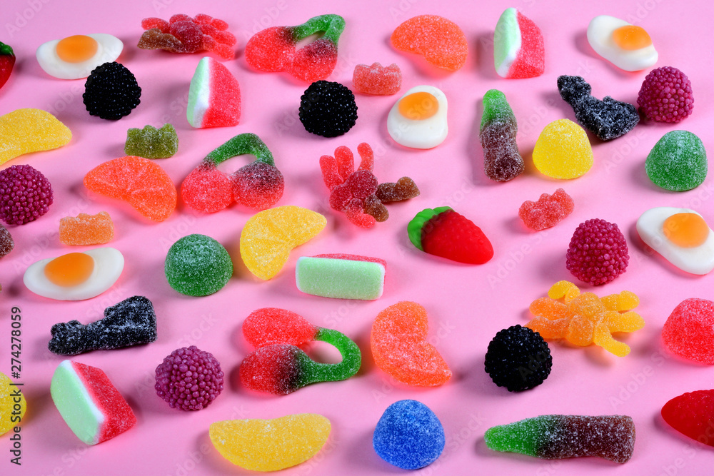 group of gummy candies on pink background group of gummy candies on pink background