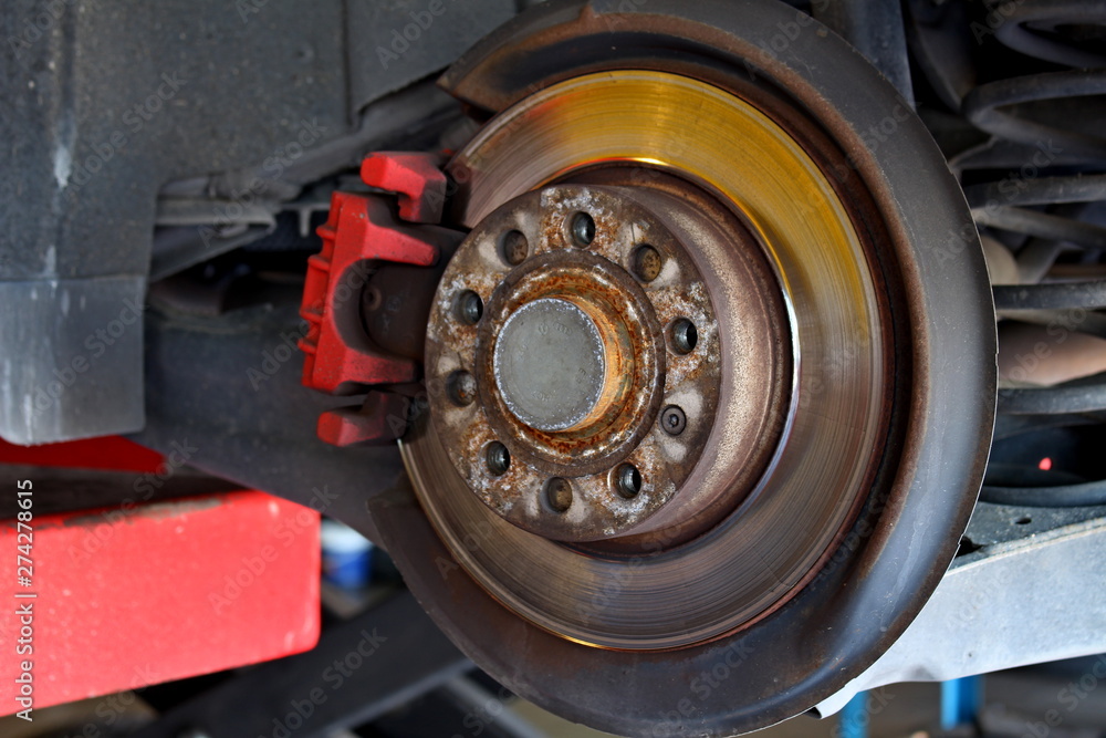 car disc brake visible without wheel