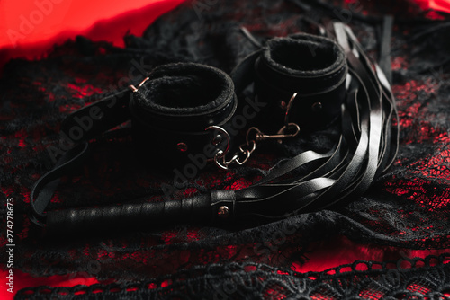 whip and handcuffs with lace underwear for BDSM sex