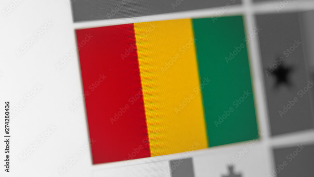 Fototapeta premium Guinea national flag of country. Guinea flag on the display, a digital moire effect.