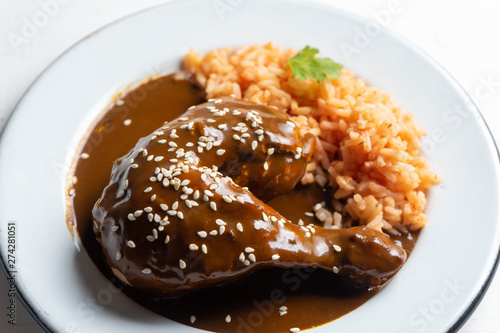 Mexican chicken with mole sauce and red rice photo