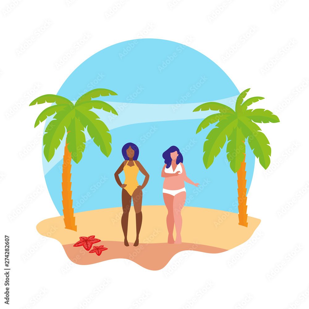 young interracial girls couple on the beach summer scene