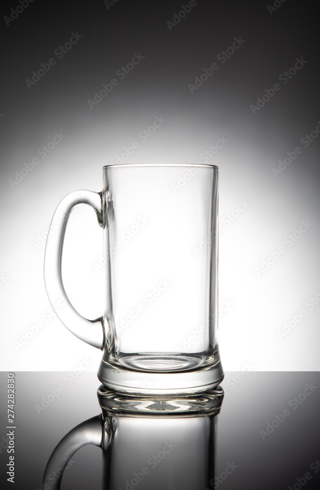 Empty clear beer mug, isolated on white background Empty clear beer mug, isolated on white background