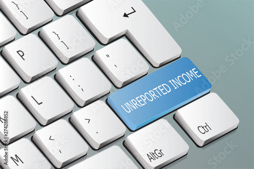 unreported income written on the keyboard button photo