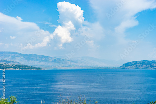 View from Kerkira Corfu island to the Albanian coast over the sea at the Kassopei from the road photo