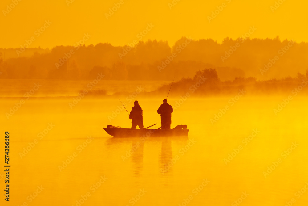 silhouette of a fisherman at sunset