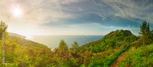 Panoramic view of Monte Ulia Mount at sunset with the Faro de la Plata (lighthouse) and the Cantabrian Sea in background. Pasaia, Gipuzkoa, Basque country, Spain. photo