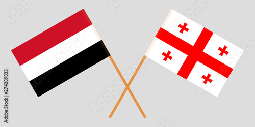 Georgia and Yemen. Crossed Georgian and Yemeni flags photo