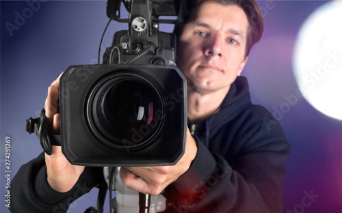 Cameraman working with camera isolated © BillionPhotos.com