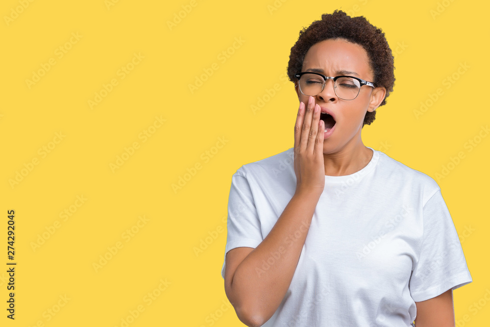 Beautiful young african american woman wearing glasses over isolated background bored yawning tired covering mouth with hand. Restless and sleepiness. Beautiful young african american woman wearing glasses over isolated background bored yawning tired covering mouth with hand. Restless and sleepiness.