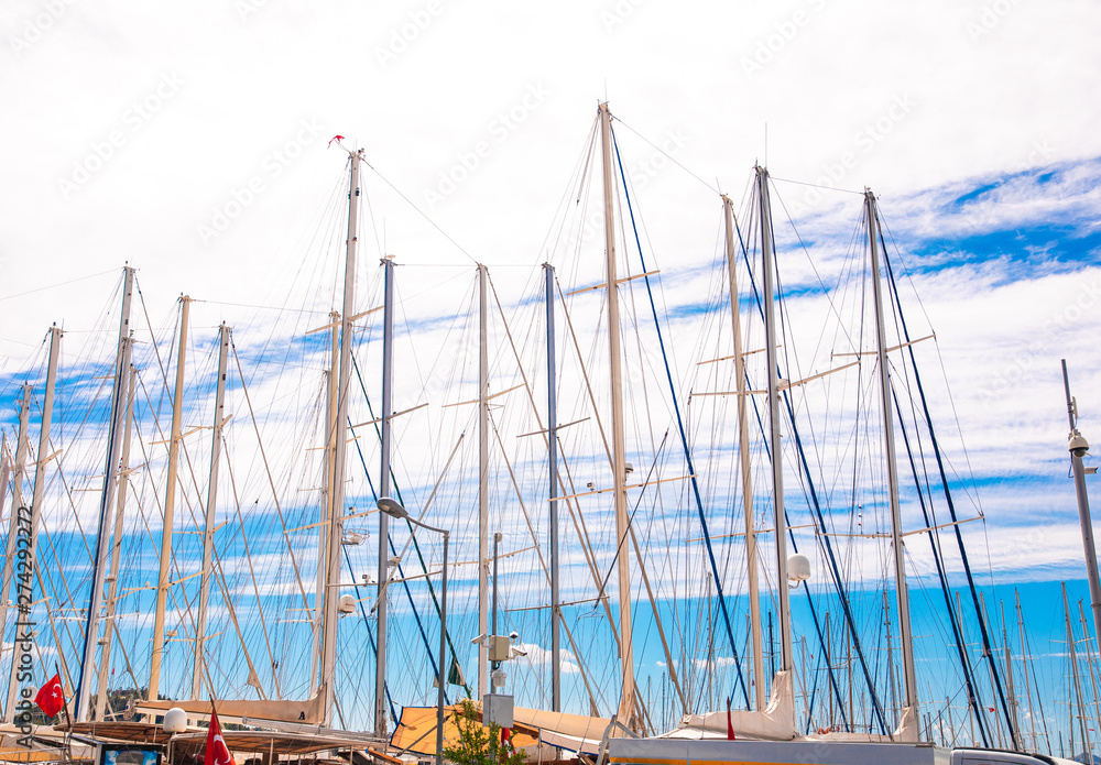 Masts of Docked Sailboats, Sailing boats or Yachts in Marina. View of marina in Bodrum town or city in Turkey. Masts of Docked Sailboats, Sailing boats or Yachts in Marina. View of marina in Bodrum town or city in Turkey.