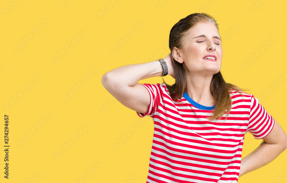 Middle age mature woman wearing casual t-shirt over isolated background Suffering of neck ache injury, touching neck with hand, muscular pain