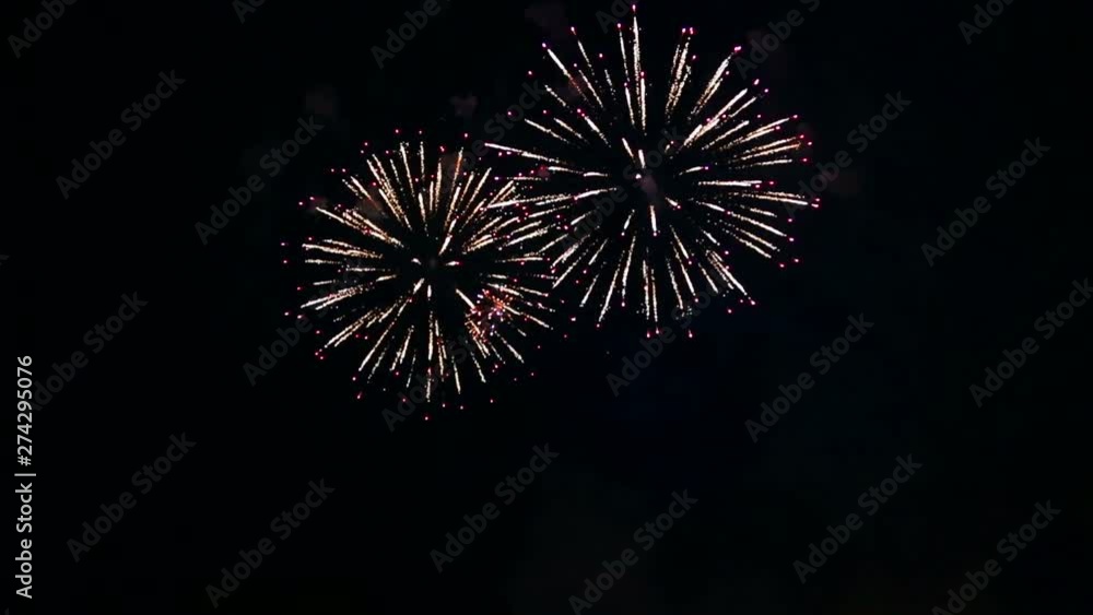cheerful fiery sparks of festive fireworks in the night sky. cheerful fiery sparks of festive fireworks in the night sky.