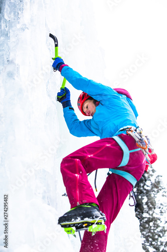 Professional climber Ines Papert ice climbing in Hyalite Canyon, Montana while instructing the women's only ice climbing clinic, a part of the 17th Annual Arc'teryx Bozeman Ice Climbing Festival. photo