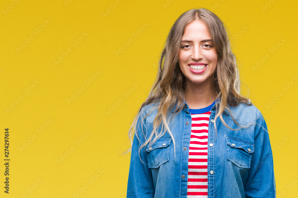 Beautiful young blonde woman over isolated background with a happy and cool smile on face. Lucky person. Beautiful young blonde woman over isolated background with a happy and cool smile on face. Lucky person.
