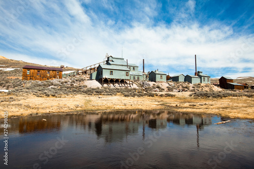 The old mill reflects off of a pond at the Bodie gold mining ghost town in California.