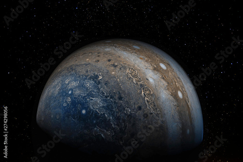 Jupiter and stars above. Elements of this image furnished by NASA.