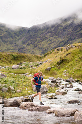 Carrantuohill (mountain), Coomcallee, Kerry, Ireland: Crossing a  mountain creek during a hike up the highest mountain in Ireland. photo