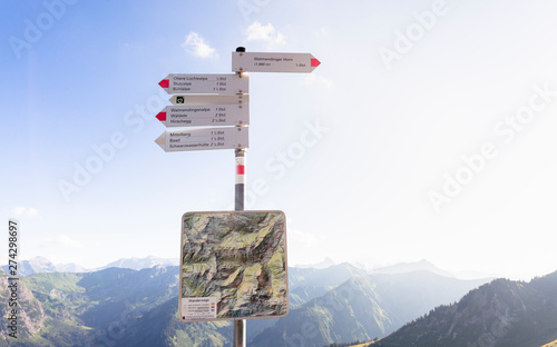 Walmendingerhorn, Kleinwalsertal, Austria: A guidepost close to the top of the Walmendingerhorn with the Alps in the background. photo