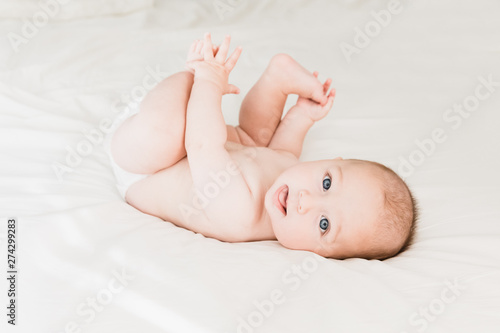 Cute Happy Baby On Bed Lifestyle Neutral Colors Baby Boy Eye Contact