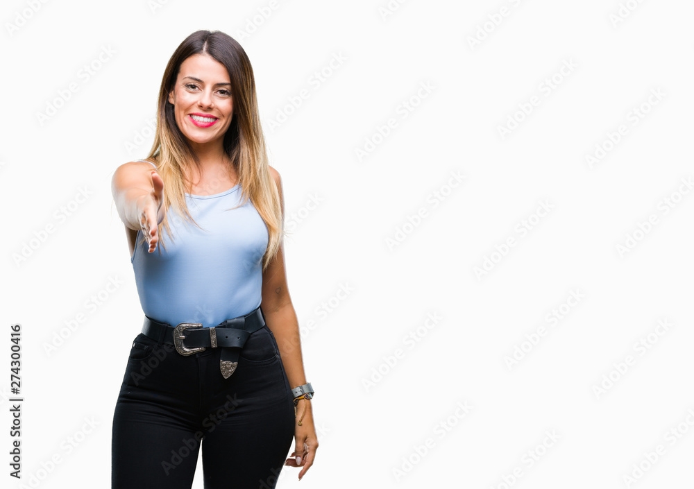 Young beautiful elegant business woman over isolated background smiling friendly offering handshake as greeting and welcoming. Successful business. Young beautiful elegant business woman over isolated background smiling friendly offering handshake as greeting and welcoming. Successful business.