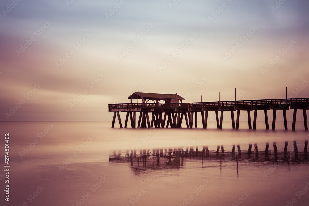 Fishing wooden pier at Folly Beach. Folly Beach Island, Charleston, South Carolina, USA Fishing wooden pier at Folly Beach. Folly Beach Island, Charleston, South Carolina, USA