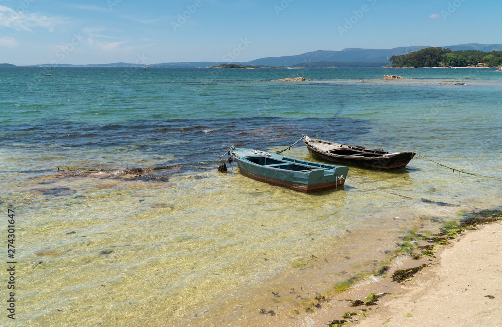 Marine landscape of Rias Baixas, Galicia with two small boats called Chalanas