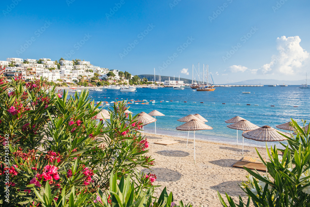 View of Bodrum Beach, Aegean sea, traditional white houses, marina, sailing boats, yachts in Bodrum town Turkey. 