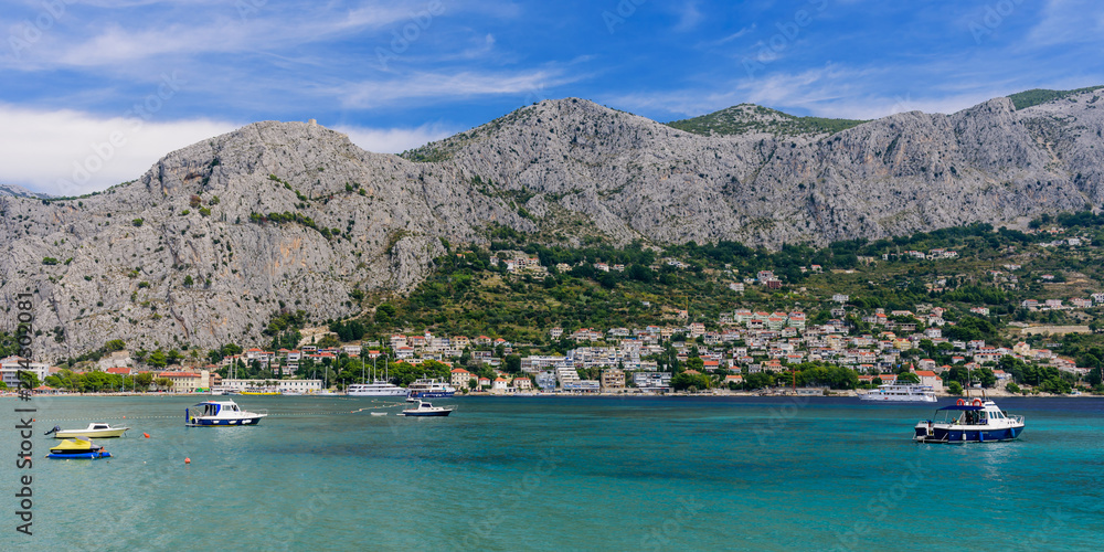 The picturesque coastline of the Adriatic sea in the town of Omis, Makarska Riviera, Dalmatia region, Croatia