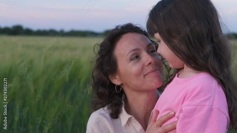Portrait of happy mom with kid. Lovely mother with her daughter in nature. Portrait of happy mom with kid. Lovely mother with her daughter in nature.