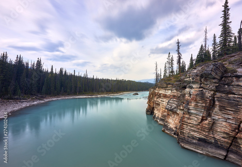 The turquoise water of the Athabasca River immediately after the Falls