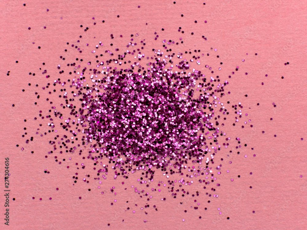 Pink glitter sparkle on pink background with place for your text Pink glitter sparkle on pink background with place for your text