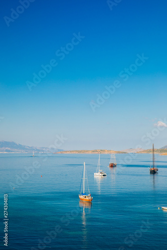 View of the Bodrum Marina, sailing boats and yachts in Bodrum town, city of Turkey. Shore and coast of Aegean Sea with yachts 