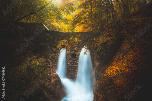 Fototapeta Naklejka Na Ścianę i Meble -  Hidden waterfall in a mystic forest