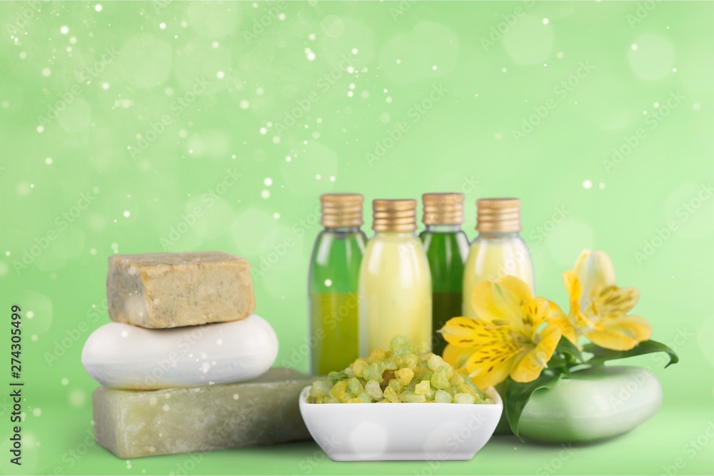 Bottles with organic essential aroma oils on background Bottles with organic essential aroma oils on background