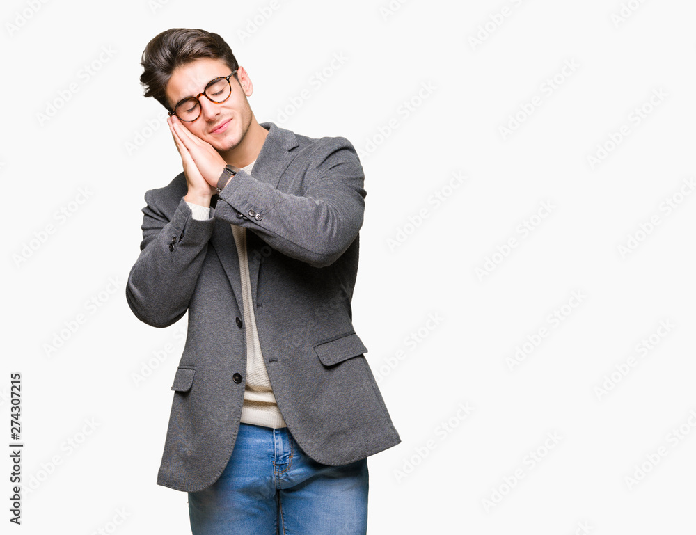 Young business man wearing glasses over isolated background sleeping tired dreaming and posing with hands together while smiling with closed eyes. Young business man wearing glasses over isolated background sleeping tired dreaming and posing with hands together while smiling with closed eyes.