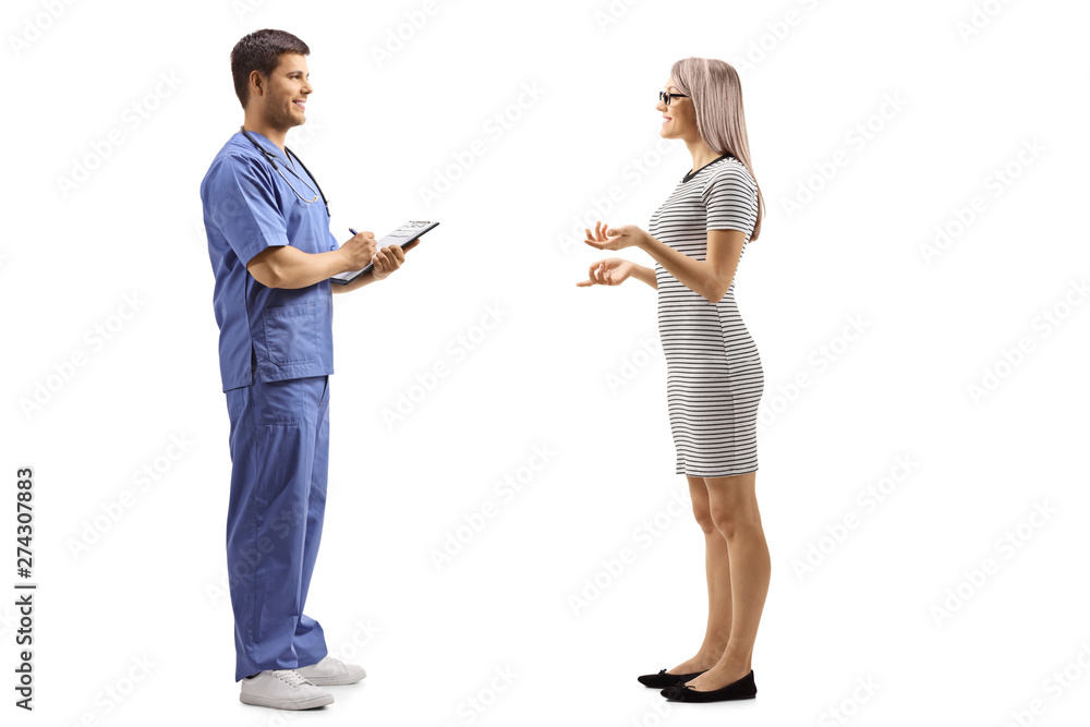 Young woman talking to a male doctor in a blue uniform Young woman talking to a male doctor in a blue uniform
