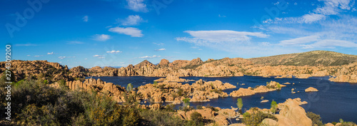 Panorama of the rugged beauty of Watson Lake in Prescott Arizona.  This reservoir is surrounded be weathered cliffs of the Granite Dells and blear blue skies.