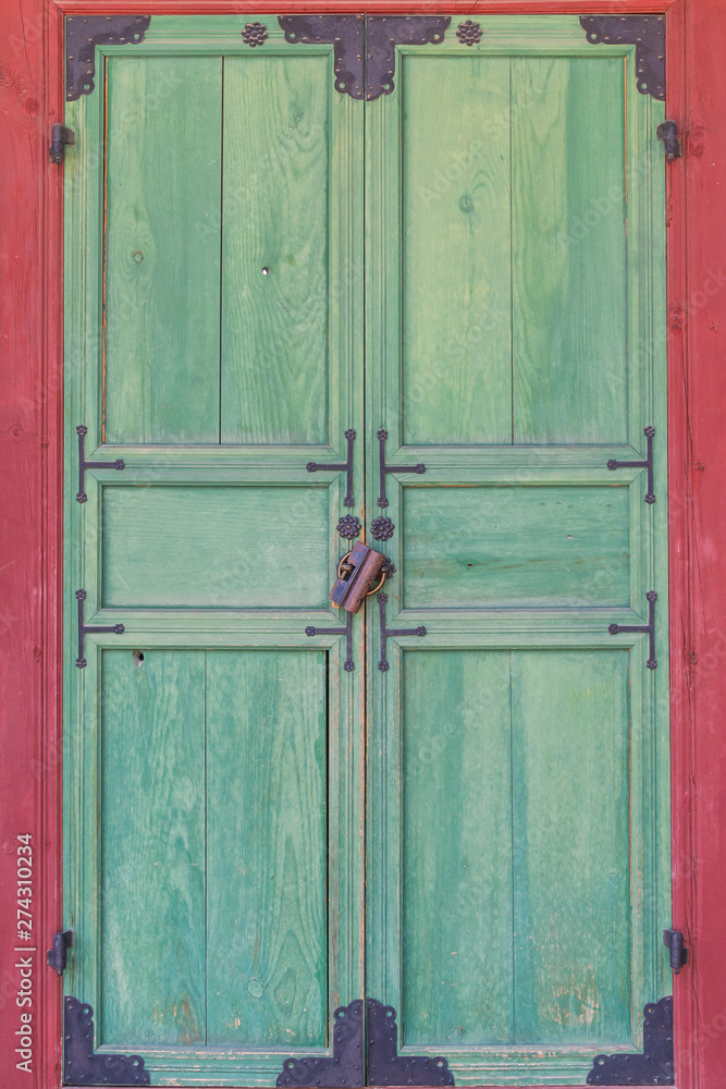 A traditional Korean gateway closed and locked. A traditional Korean gateway closed and locked.