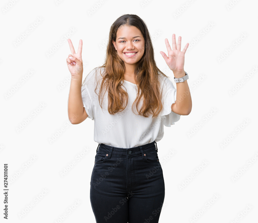 Young beautiful brunette business woman over isolated background showing and pointing up with fingers number seven while smiling confident and happy. Young beautiful brunette business woman over isolated background showing and pointing up with fingers number seven while smiling confident and happy.