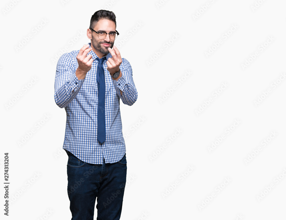 Young business man wearing glasses over isolated background Doing money gesture with hand, asking for salary payment, millionaire business Young business man wearing glasses over isolated background Doing money gesture with hand, asking for salary payment, millionaire business