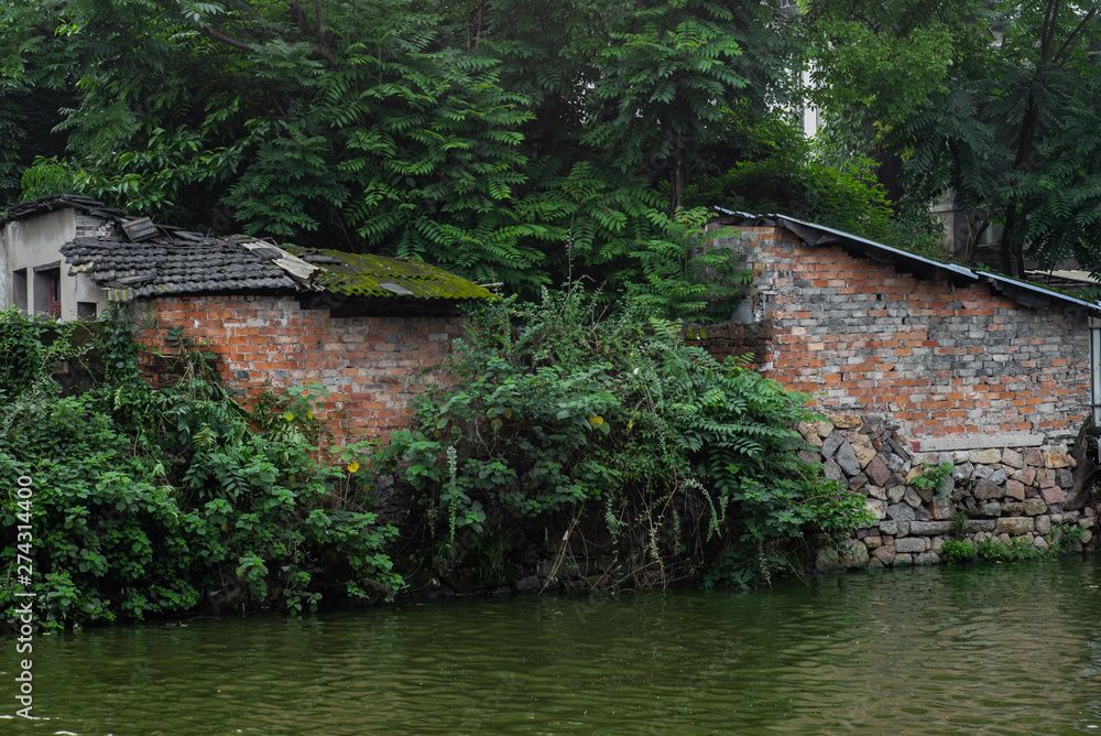 The back of old houses  along a creeks in a park in Wenzhou in China - 1